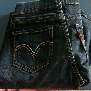 Size Medium, Never been worn, Levi Low ride mid wash jeans